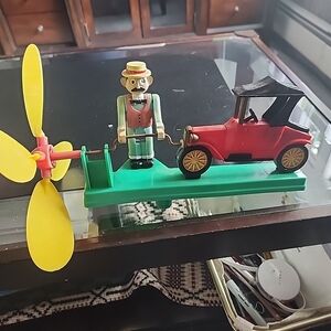 Classic Red Toy Car with Wind-Up Driver